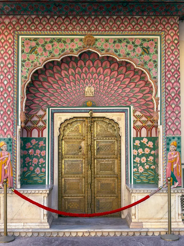 The peacock gate at Pritam Niwas Chowk, brass doors under a painted arch