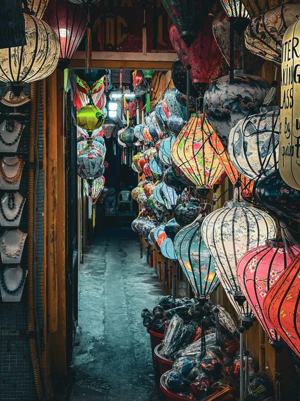 A narrow shop in Hoi An packed floor to ceiling with silk lanterns